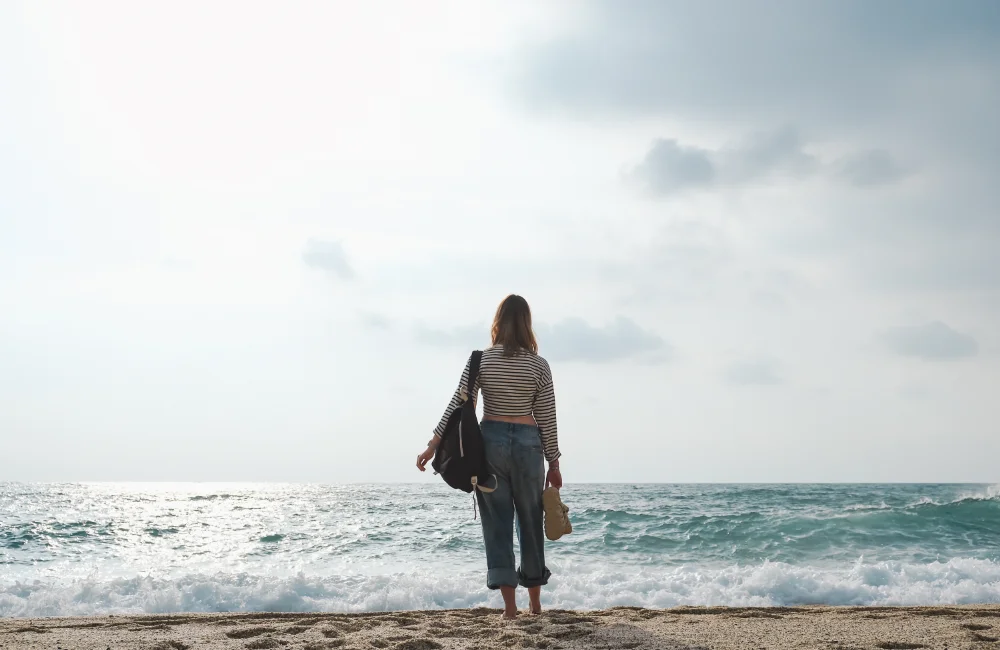 a woman looking at the sea